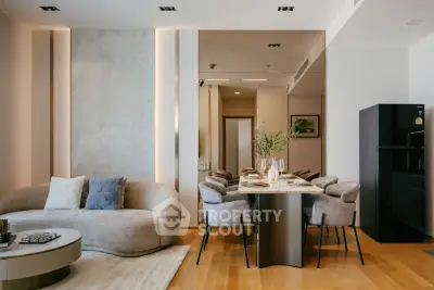 Elegant modern living and dining area with stylish furniture and decor