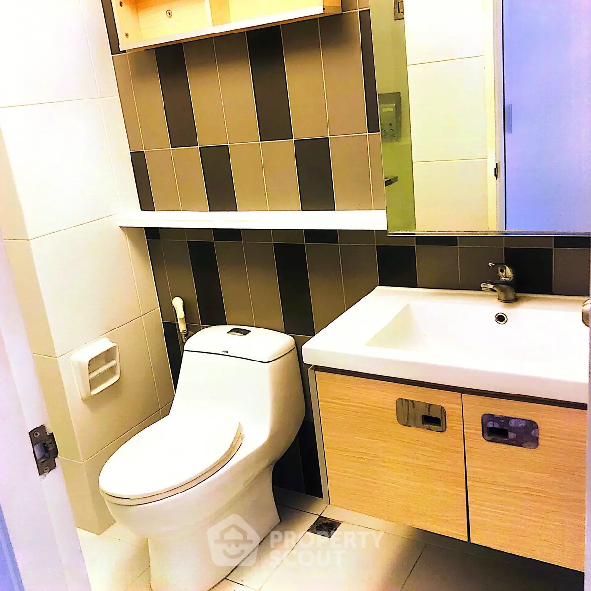 Modern bathroom with sleek fixtures and stylish tile design.