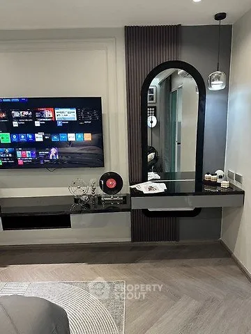 Modern living room with sleek TV setup and stylish decor