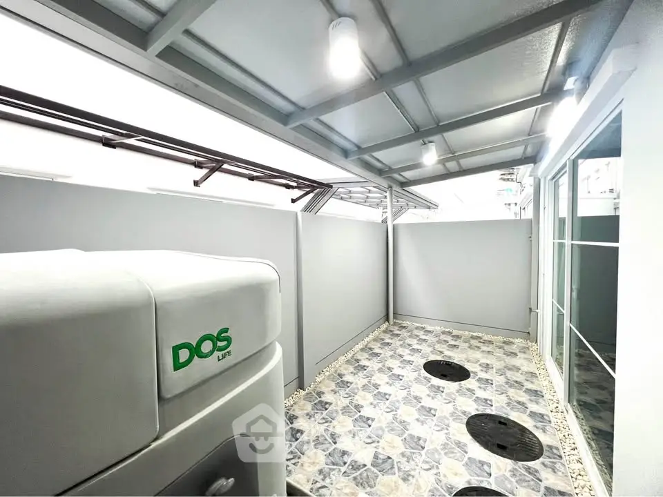 Modern outdoor utility area with sleek design and ample lighting, perfect for functional use.