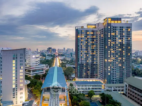 Stunning cityscape view with modern high-rise buildings at dusk, showcasing urban living.