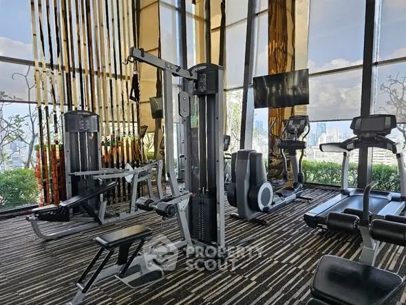 Luxurious high-rise gym with modern equipment and stunning city views.