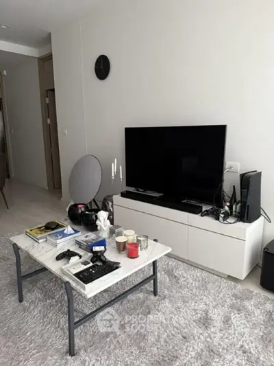 Modern living room with sleek TV setup and cozy decor