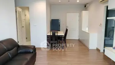 Modern apartment interior with sleek furniture and wooden flooring