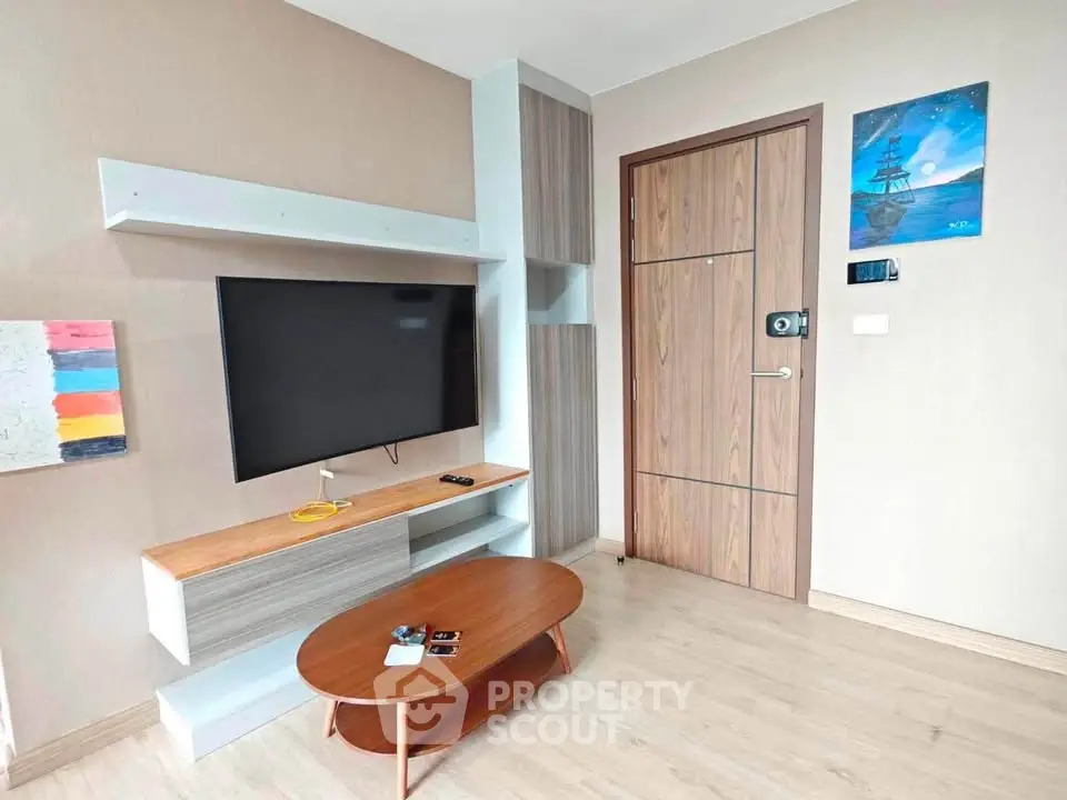Modern living room with sleek TV setup and stylish wooden furniture