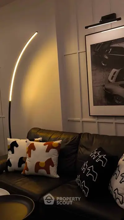 Stylish living room with modern lighting and chic decor pillows