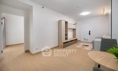 Modern living room with minimalist decor and sleek wooden flooring