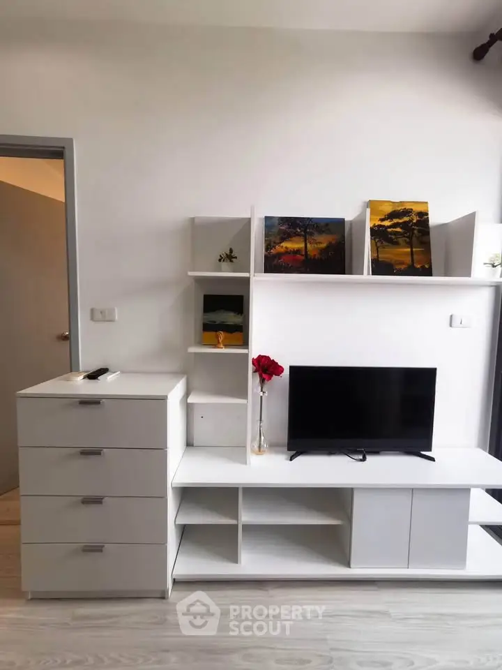 Modern living room with sleek white furniture and stylish decor