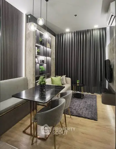 Modern living room with elegant decor, featuring a cozy seating area and stylish lighting.