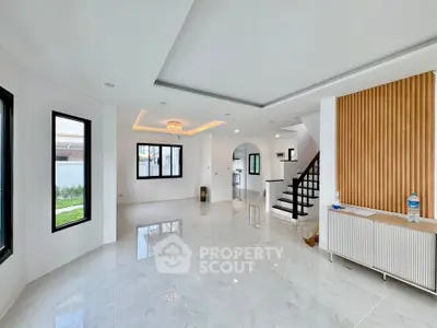 Spacious modern living room with elegant design and large windows