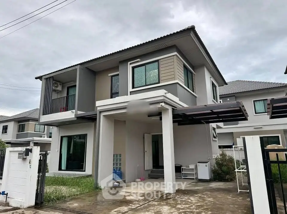 Modern two-story house with sleek design and spacious driveway