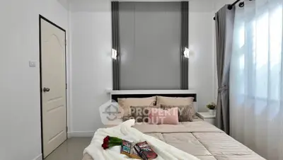 Cozy bedroom with elegant decor and soft lighting, perfect for relaxation.