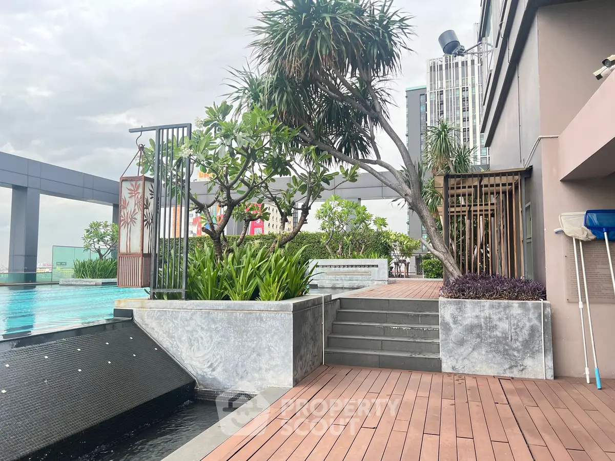 Luxurious rooftop pool area with modern design and lush greenery, perfect for relaxation and leisure.