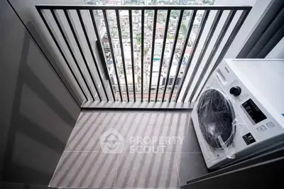 Modern balcony with city view and washing machine, perfect for urban living.