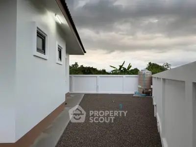 Modern rooftop space with gravel flooring and scenic views