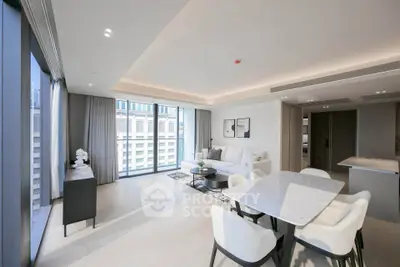 Luxurious modern living room with open dining area and large windows offering city views.