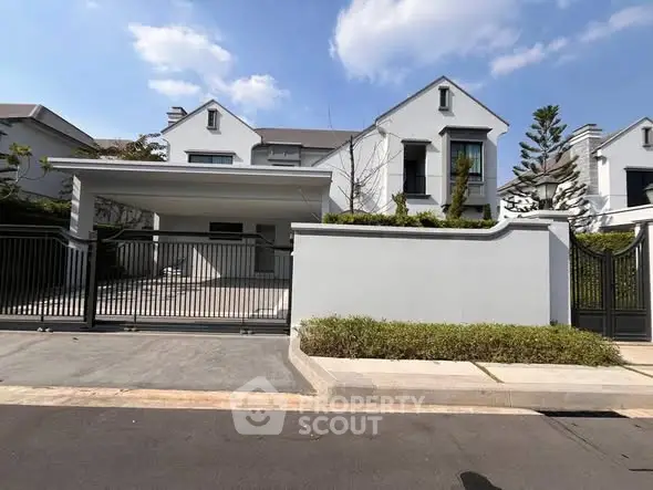 Elegant modern house with sleek design and spacious driveway, perfect for luxury living.