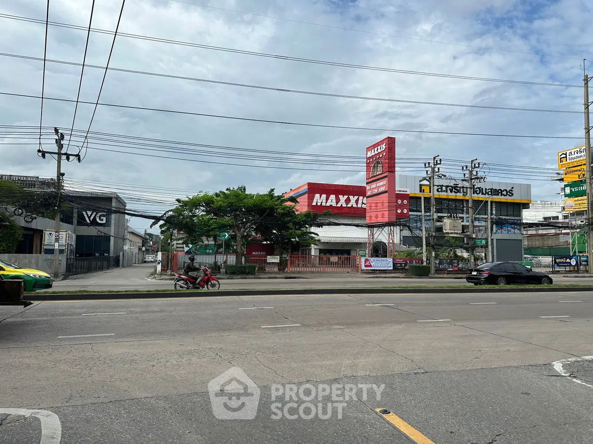 Commercial property with prominent signage on a busy street, ideal for retail or business use.
