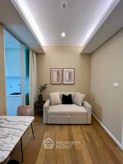 Chic modern living room with cozy sofa and elegant decor, perfect for urban living.