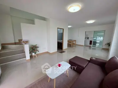Spacious modern living room with open layout and sleek furniture
