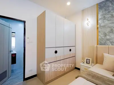 Modern bedroom with stylish wardrobe and cozy decor