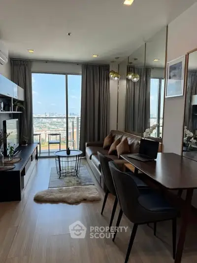 Modern living room with city view, stylish furniture, and natural light