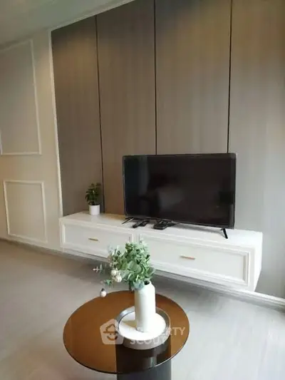 Modern living room with sleek TV setup and elegant decor