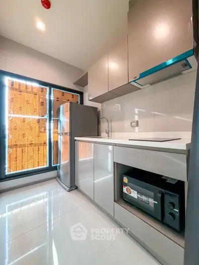 Modern kitchen with sleek cabinetry and stainless steel appliances