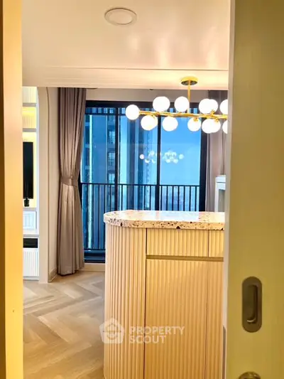Modern apartment interior with stylish lighting and balcony view