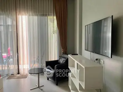 Modern living room with sleek furniture and large window view