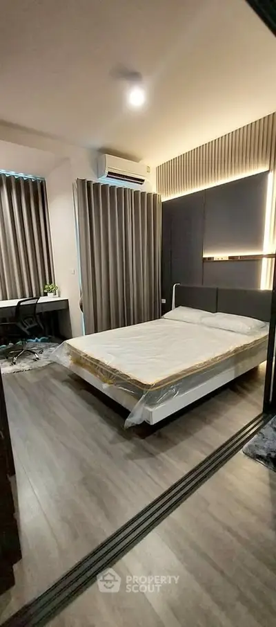 Modern bedroom with sleek design and ambient lighting