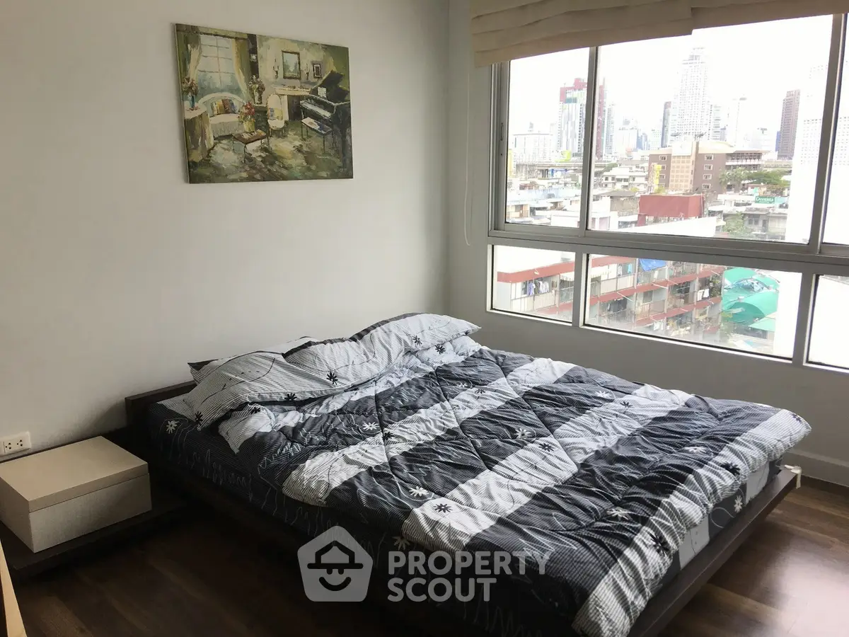 Modern bedroom with city view and stylish decor in urban apartment