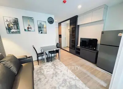 Modern living room with stylish decor and open kitchen layout