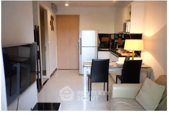 Modern apartment interior with sleek kitchen and cozy dining area