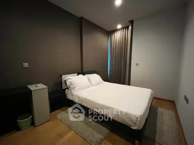 Modern bedroom with cozy double bed and stylish decor in a contemporary apartment.