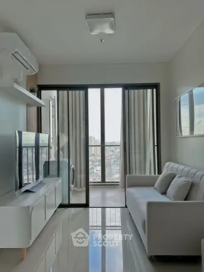 Modern living room with sleek design and city view balcony