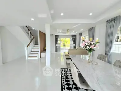 Spacious modern living room with elegant dining area and stylish decor