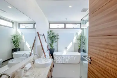 Luxurious modern bathroom with freestanding tub and elegant fixtures