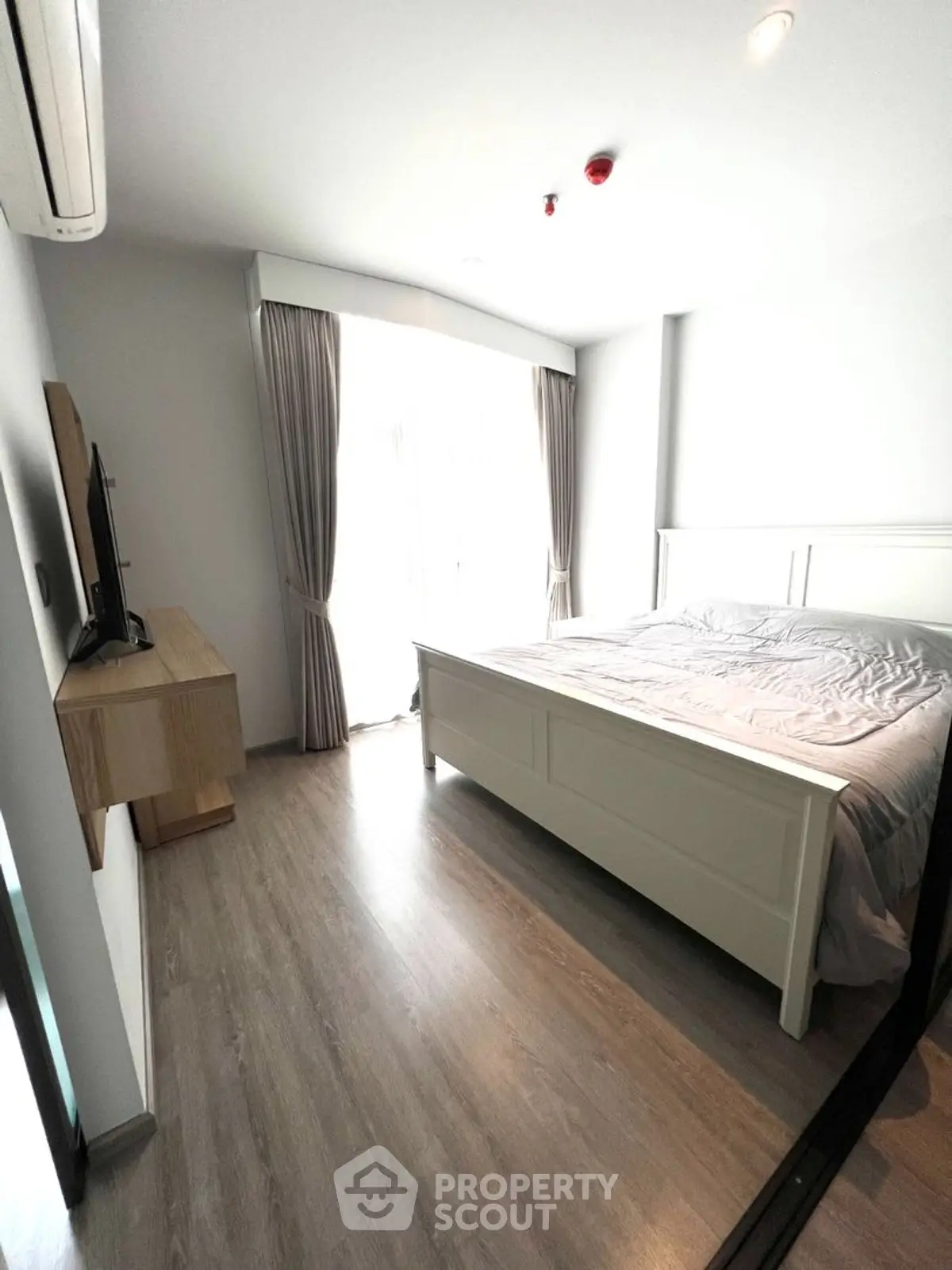 Modern bedroom with natural light and stylish decor