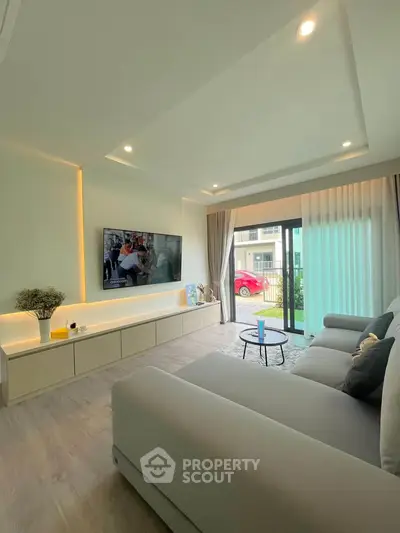 Modern living room with sleek design and large window view