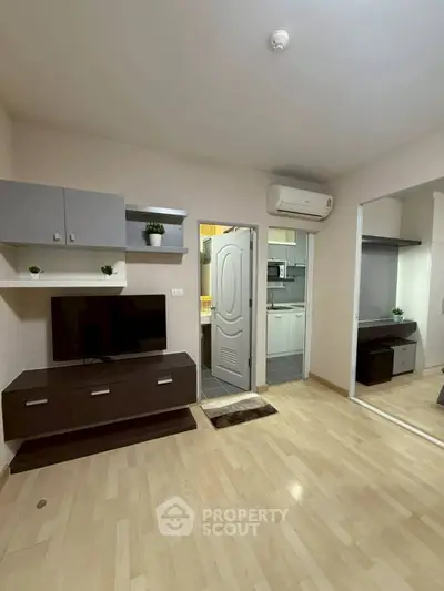 Modern living room with sleek furniture and open kitchen view