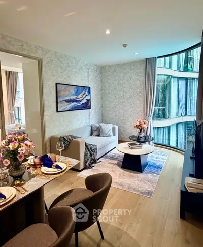 Luxurious modern living room with elegant decor and large windows offering stunning views.