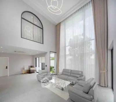 Luxurious modern living room with high ceilings and elegant furnishings