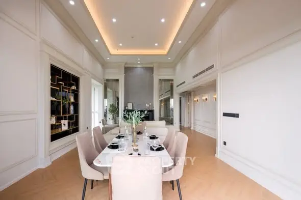 Luxurious dining area with elegant decor and high ceilings in a modern home