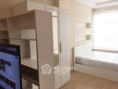 Modern bedroom with sleek furniture and natural light