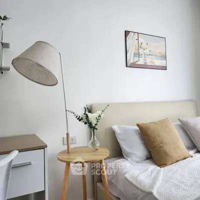 Cozy bedroom with stylish decor and modern furniture, perfect for relaxation.