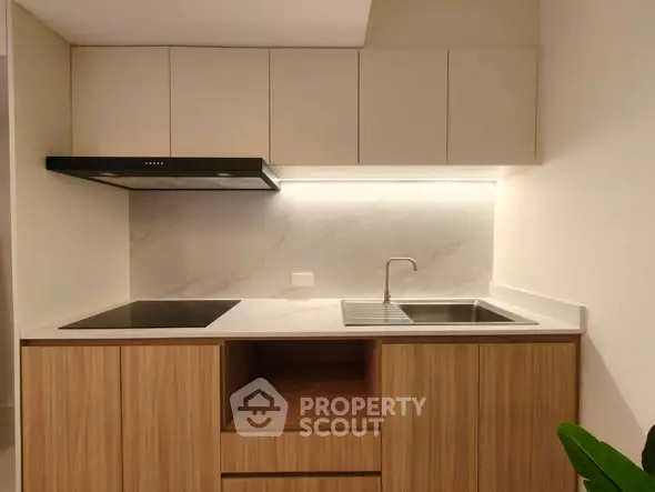 Modern minimalist kitchen with sleek cabinetry and integrated appliances