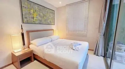 Elegant bedroom with modern decor and large window in luxury apartment