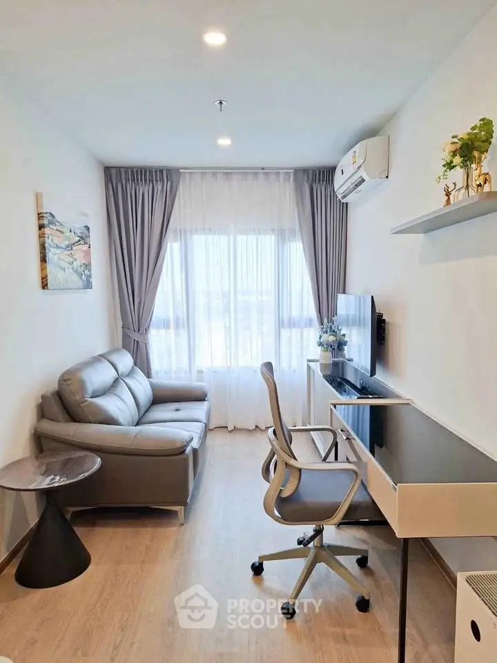 Modern living room with sleek furniture and natural light, perfect for urban living.