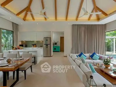 Spacious open-plan living room with modern kitchen and elegant decor